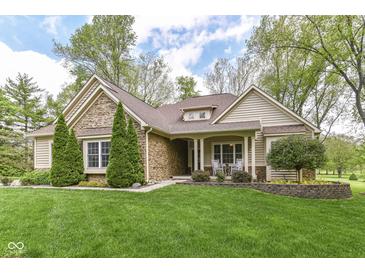 Charming home with stone and siding, manicured lawn, and mature trees at 6340 W 800 S, Pendleton, IN 46064