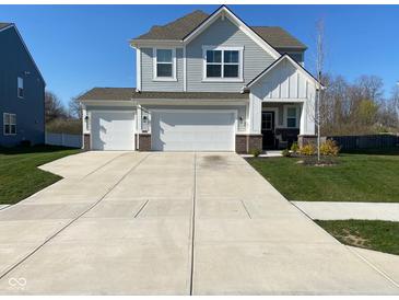 Beautiful two-story home with a three-car garage and well-maintained lawn at 9074 Larson Dr, Pendleton, IN 46064