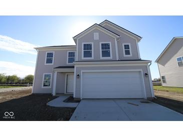 Charming two-story home with a two-car garage and classic architectural details at 3942 Seeger St, Indianapolis, IN 46239