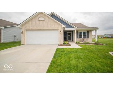 Charming single-story home with brick facade, attached garage, and well-maintained lawn at 505 Shallowroot Ln, Sheridan, IN 46069