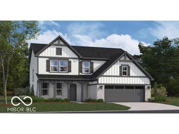 Two-story home with white and gray siding and a two-car garage, showcasing a modern aesthetic at 5774 Cloister Ln, McCordsville, IN 46055