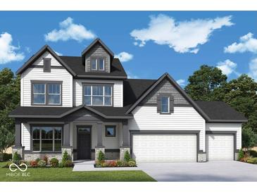 Charming two-story home featuring a well-manicured lawn, white siding and a welcoming front porch at 19534 Wood Farm Pl, Westfield, IN 46074