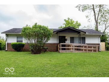 Charming single-story home with a brick foundation and a well-maintained front yard at 5605 Glencoe St, Indianapolis, IN 46226