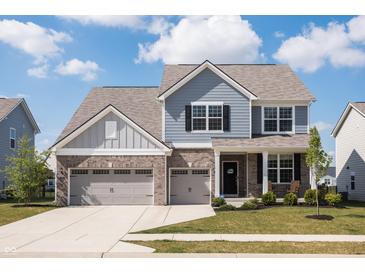 Charming two-story home with blue siding, brick accents, and a spacious two-car garage at 5770 Flagler Ln, Brownsburg, IN 46112