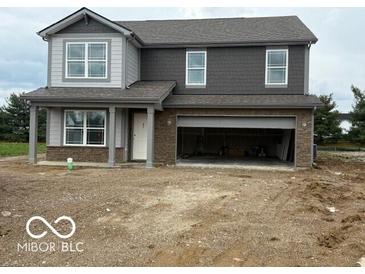 New two-story home featuring a two-car garage and neutral-colored exterior at 7509 Big Bend Blvd, Camby, IN 46113