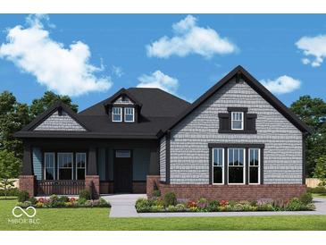 Charming two-story home with a shingle and brick exterior and inviting covered front porch at 11467 Selsey Rd, Fishers, IN 46040