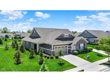 Beautiful aerial view of a well-maintained home with lush landscaping and a charming neighborhood setting at 4965 Eldon Dr, Noblesville, IN 46062