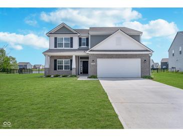 Charming two-story home with a well-manicured lawn and brick accents, providing great curb appeal at 991 Terra Ln, Franklin, IN 46131
