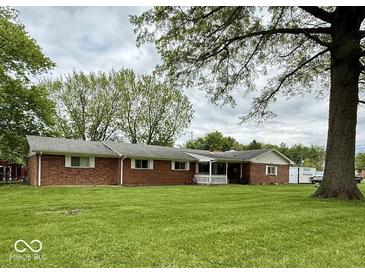 Charming single-story home featuring a well-maintained lawn and traditional brick exterior at 10946 Maze Rd, Indianapolis, IN 46259