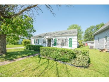 Charming home featuring a well-manicured front yard and classic architectural details at 1932 Central Ave, Columbus, IN 47201