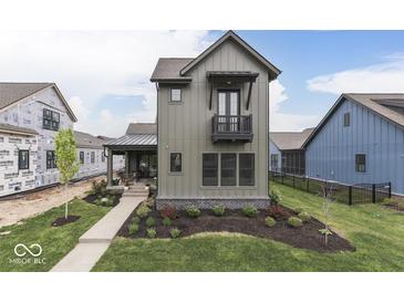 Charming craftsman-style home featuring board and batten siding and a small balcony at 17346 Newton Main St, Westfield, IN 46074