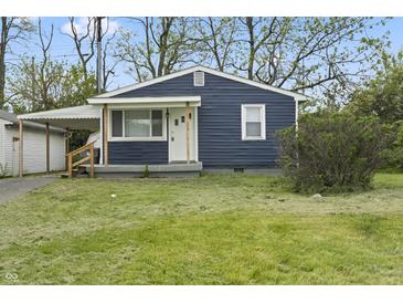 Charming single-story home with a well-maintained lawn and covered carport at 2344 N Leland Ave, Indianapolis, IN 46218
