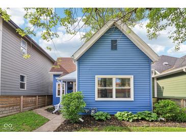 Charming blue home with well-maintained lawn and a cozy, inviting curb appeal at 253 E Minnesota St, Indianapolis, IN 46225