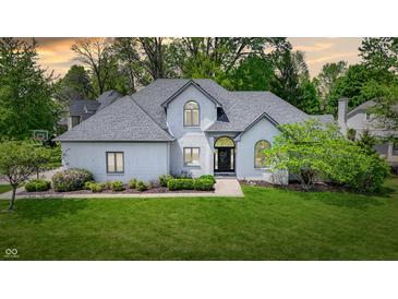 Charming home with well-manicured lawn, lush landscaping, and a welcoming entrance creating great curb appeal at 3162 Hazel Foster Dr, Carmel, IN 46033