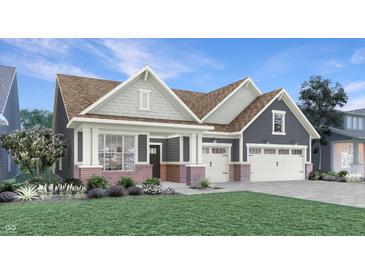 Charming single Gathering home boasts a manicured lawn, two car garage, and inviting covered front porch at 5127 Foxley Park Ln, Avon, IN 46123