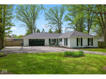 Charming single-story home featuring a two-car garage and well-manicured front lawn at 6673 Karyn Dr, Avon, IN 46123