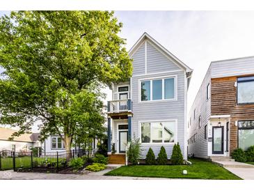 Charming two-story home with a manicured lawn and inviting curb appeal at 952 Elm St, Indianapolis, IN 46203