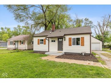 Charming single-story home featuring neutral siding, wood shutters, and a well-maintained yard at 2006 N Moreland Ave, Indianapolis, IN 46222