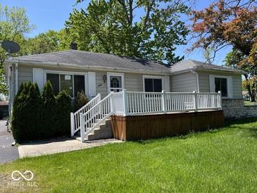 Charming single-story home featuring a welcoming front porch and well-maintained lawn at 3209 Mounds Rd, Anderson, IN 46016