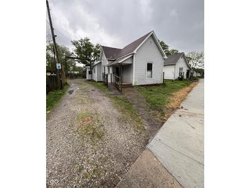 Charming single-Gathering home featuring a gravel driveway and welcoming front porch at 350 Johnson Ave, Franklin, IN 46131