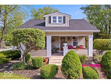 Charming home with landscaped front yard and inviting porch at 744 Gilbert Ave, Indianapolis, IN 46227