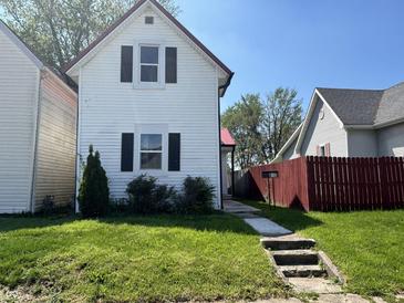 Charming two-story home with red roof and a well-maintained front yard at 810 S 18 Th St, Elwood, IN 46036