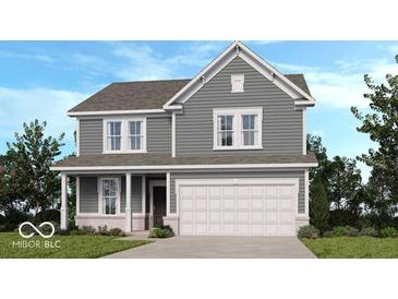 Charming two-story home featuring a covered porch and a two car garage at 1107 Stubble Run, Danville, IN 46122