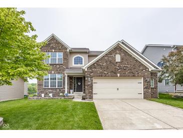 Charming two-story brick home with a well-maintained lawn and attached two car garage at 11818 Bellhaven Dr, Fishers, IN 46038