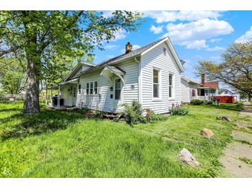 Charming two-story home with white siding and a well-maintained lawn in a residential neighborhood at 1610 S F St, Elwood, IN 46036