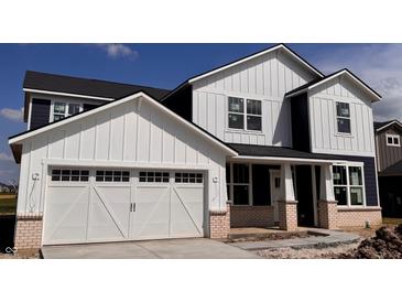 Charming new two-story home featuring white siding and a two-car garage at 18943 Seaforth Way, Westfield, IN 46074