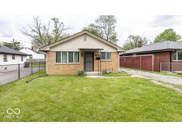 Charming brick home with well-maintained lawn and inviting curb appeal at 3510 E 34Th St, Indianapolis, IN 46218