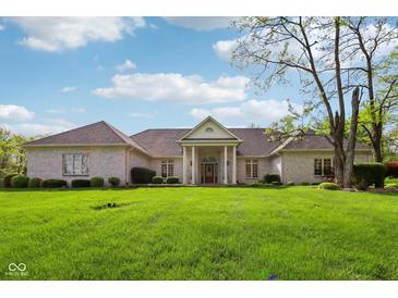 Charming single-story home with manicured lawn and inviting front entrance at 965 W Main St, Greenwood, IN 46142