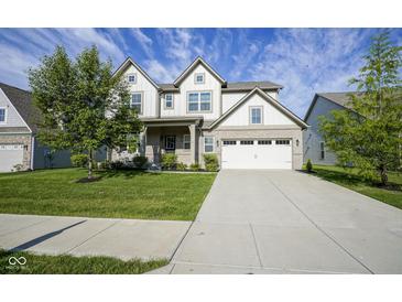 Charming two-story home with a well-manicured lawn and a spacious two car garage, perfect for Gathering living at 9822 Tampico Chase, Fishers, IN 46040
