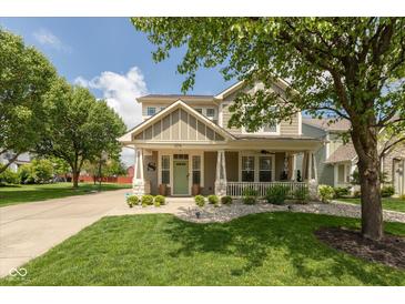 Charming two-story home with a covered porch and well-manicured lawn, perfect for Gathering living at 1274 Old Heritage Pl, Greenwood, IN 46143