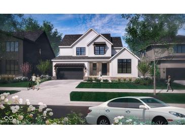 Charming two-story home with a two car garage, brick accents, and a manicured lawn at 1415 Beaumont Cir, Westfield, IN 46074