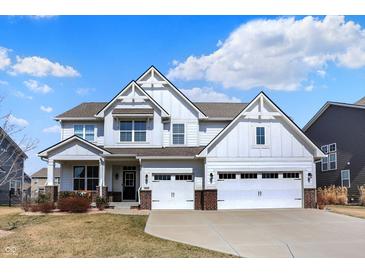Charming two-story home boasts a manicured lawn, a welcoming porch, and a convenient two-car garage, ideal for Gathering living at 16516 Wilsons Farm Dr, Fishers, IN 46040