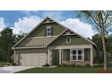 Charming craftsman-style home with green siding, stone accents, covered porch, and attached two-car garage at 2047 Quail W Dr, Danville, IN 46122