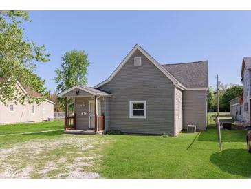 Charming single-story home features gray siding, an eagle over the porch, and a well-maintained front yard at 2319 S I St, Elwood, IN 46036