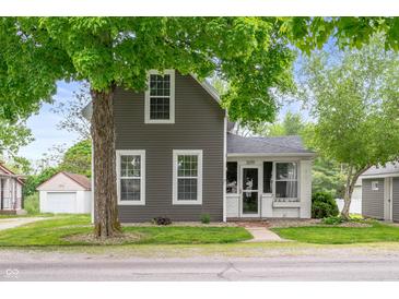 Charming two-story home with gray siding, white trim, and a well-maintained front yard at 3019 W Huntsville Rd, Pendleton, IN 46064