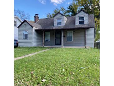 Charming single Gathering home featuring a covered front porch and classic architectural details at 3731 N Tacoma Ave, Indianapolis, IN 46218