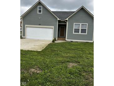 Charming single-Gathering home featuring a two-car garage and well-maintained front yard at 336 W 29Th St, Indianapolis, IN 46208