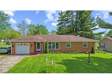 Charming brick ranch home featuring a well-manicured lawn and an attached single-car garage at 6191 Geneva St, Stilesville, IN 46180