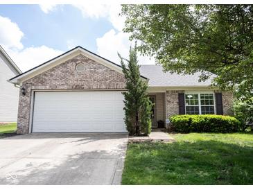 Charming single-story home with a two-car garage, and a well-maintained front yard at 7131 Blue Ridge Dr, Noblesville, IN 46062