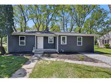 Charming single-story home with gray siding, white trim, and a well-maintained front lawn, offering great curb appeal at 807 Vasbinder Dr, Chesterfield, IN 46017