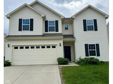 Charming two-story home featuring black shutters, a two-car garage, and a well-maintained lawn at 837 Sommersweet Run, Greenwood, IN 46143