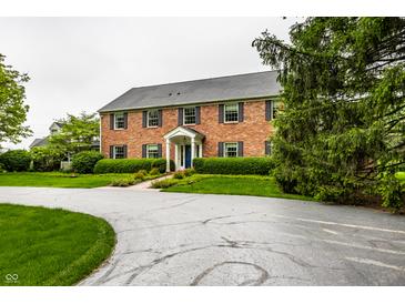 Charming two-story brick home with manicured landscaping and a welcoming entrance at 5356 S Us 421, Zionsville, IN 46077