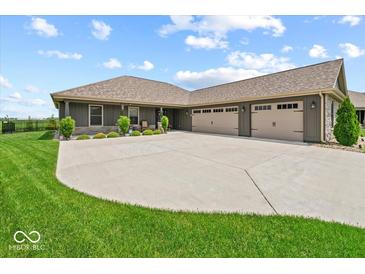 Attractive single-story home with a spacious driveway and well-maintained landscaping at 920 Alba Dr, Lebanon, IN 46052