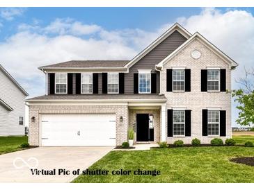 Charming two-story home with brick facade, gray siding, black shutters, and well-manicured lawn at 9860 Gallop Ln, Fishers, IN 46040