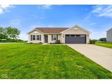 Charming single-story home with a well-maintained lawn and attached two-car garage at 204 Oakview Dr, Mooresville, IN 46158