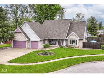 Charming home with manicured lawn, beautiful landscaping and brick accents on front elevation at 436 Maria Dr, Greenwood, IN 46143